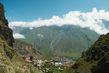 View of Caucasus Mountains and Stepantsminda village