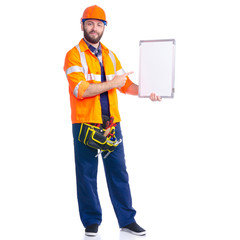 Man worker builder with helmet and tool belt, white empty board, cpase for text on white background isolation