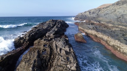 landscape and sunset on the coast contemplating the breaking of the waves on the cliffs