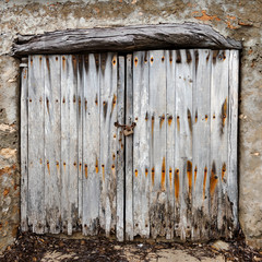 ancient weathered wooden doors of a boat house