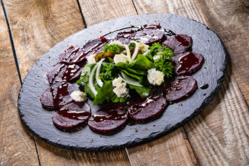 Beetroot with cottage cheese on black stone