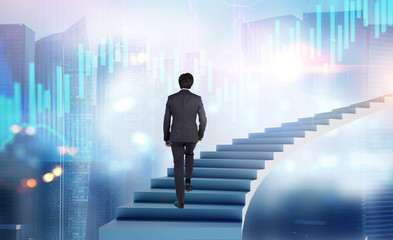 Man walking on stairs in city with graphs