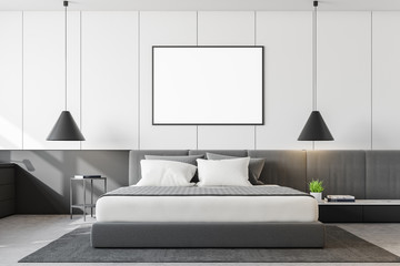 Minimalistic white bedroom with poster