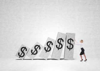 Businesswoman holding falling dollar graph