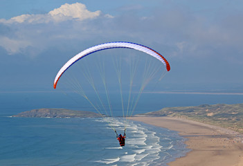 Tandem Paraglider flying above Rhossili