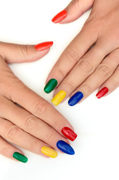 Multicolored bright manicure with different shapes of square, oval, sharp nails on a white background.