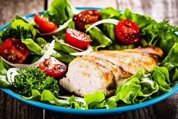 Caesar salad on wooden table