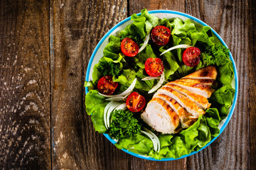 Caesar salad on wooden table