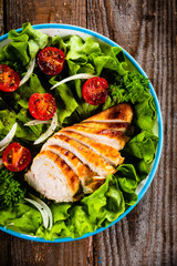Caesar salad on wooden table
