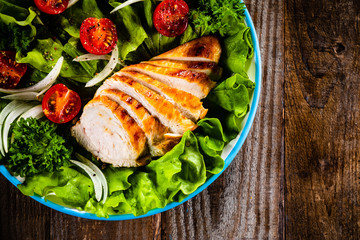 Caesar salad on wooden table