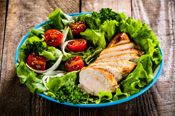 Caesar salad on wooden table