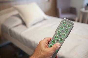 Adjustable bed remote in hand