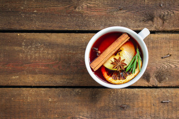 Christmas mulled wine on a wooden table. Traditional hot drink at Christmas (red wine with spices, New Year's Eve, Noel holiday festive) x-mas flat lay. food background. copy space. Top viev