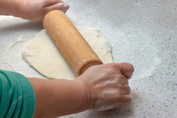 Making dough for homemade dumplings.