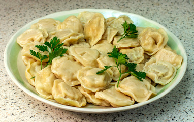 Grandmother's homemade dumplings on a dish.