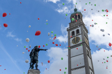Turamichele celebration with ballons in front of Perlach tower in Augsburg, Germany, Bavaria