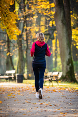 Healthy lifestyle - woman running in city park