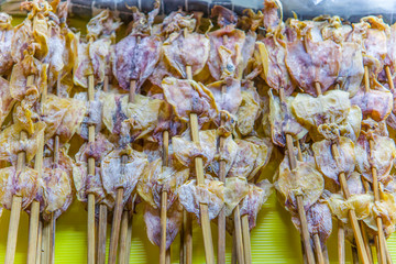 Asian street food - salted and dried fish and squid. Sun dried seafood at walking street  in Chiang mai, Thailand