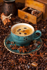 Composition with  coffee cup, coffee  beans and  spices