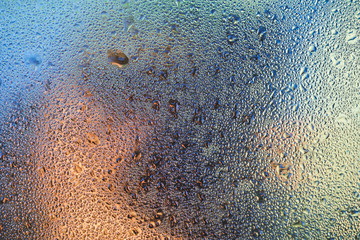 Dew drops on the car window. Beautiful background with water on the glass