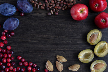 Fruit frame for design and decoration. Fresh fruits on wooden board frame background