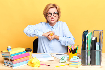 Stressed female entrepreneur has many problems at work, she has no idea what to do with problem, negative feeling and emotion, close up portrait, studio shot