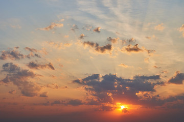 Sunrise with rays breaking through the clouds