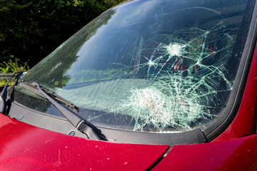 accident damaged windshield of a car