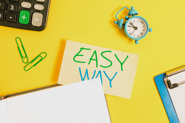 Text sign showing Easy Way. Business photo showcasing making hard decision between two less and more effort method Empty orange paper with copy space on the yellow table