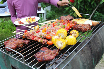 Barbeque Grill Street Food in thailand,Eat outdoors in a happy family.