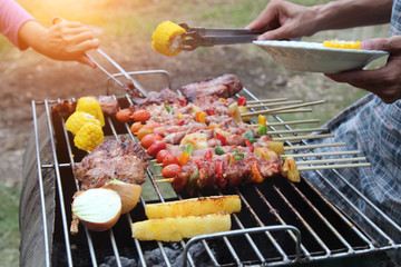 Barbeque Grill Street Food in thailand,Eat outdoors in a happy family.