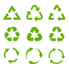 Set of green recycle arrows icons on a white background in a flat design