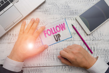 Conceptual hand writing showing Follow Up. Concept meaning Additional info or any activity that...