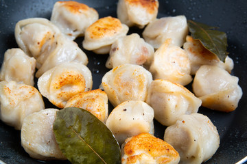 fried russian dumplings in a pan