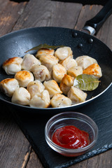 fried russian dumplings in a pan