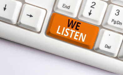 Writing note showing We Listen. Business concept for Group of showing that is willing to hear...