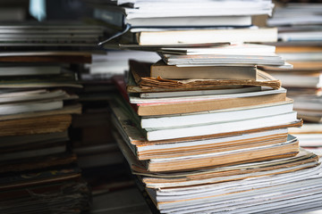 Stack of old books on wooden table, learning and education concepts. selective focus