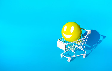 Mock up hapiness emoticon ball on cart,trolley for supermarket shopping concepts idea