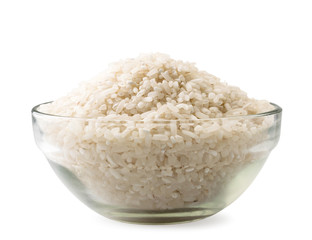 Rice groats in a glass plate on a white background. Isolated
