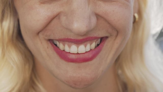 Cropped shot of a beautiful unrecognizable woman smiling. Happy mature female smiling cheerfully, showing off her healthy white teeth. Dentistry, health, beauty concept