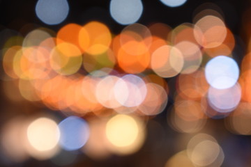 Fototapeta premium Bokeh light of orange, red, blue, coourful light for abstract background