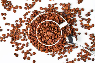 Background of coffee beans and coffee Cup and saucer. Top view.