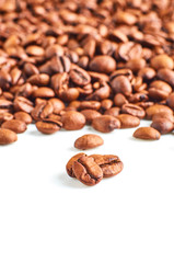 Roasted coffee beans isolated on white background with space for your text