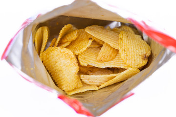 Potato chips in bag on white background.