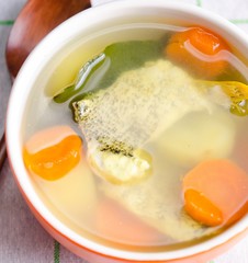 Fish soup served on the table in plate