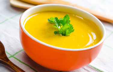 Pumpkin soup served on the table in bowl