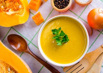 Pumpkin soup served on the table in bowl
