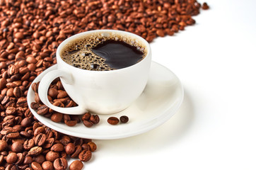 Background of coffee beans and coffee Cup with coffee saucer isolated on white background. Space is provided for your text.