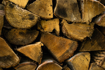 a cord of seasoned firewood all stacked up