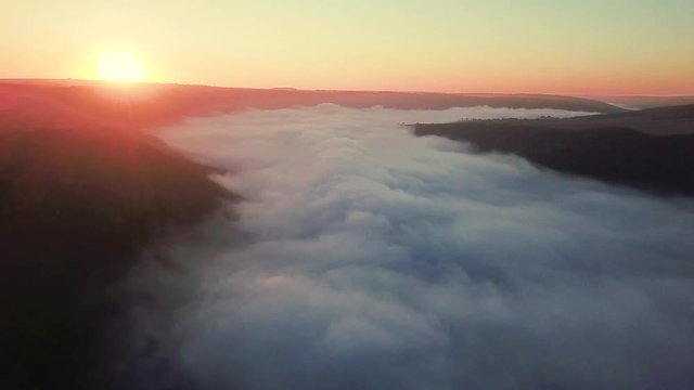 aerial view of river at sunrise, fly over morning mist on the river, Very high view of the river at sunrise, Aerial view of mystical river at sunrise with fog, sun above the river aerial